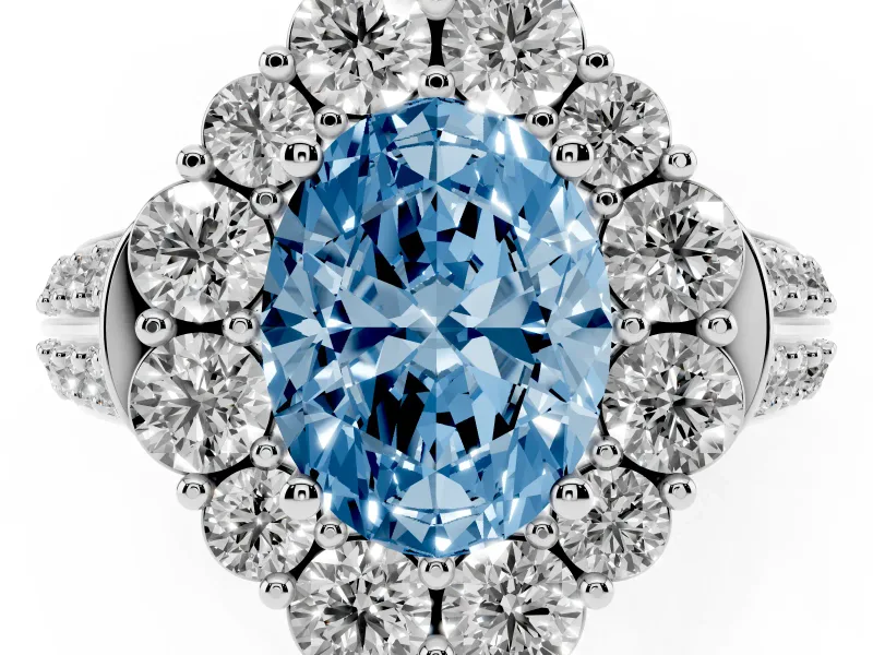 Fancy Blue Oval Cut Diamond Halo Engagement Ring Set in White gold with Split Shank and Prong Setting