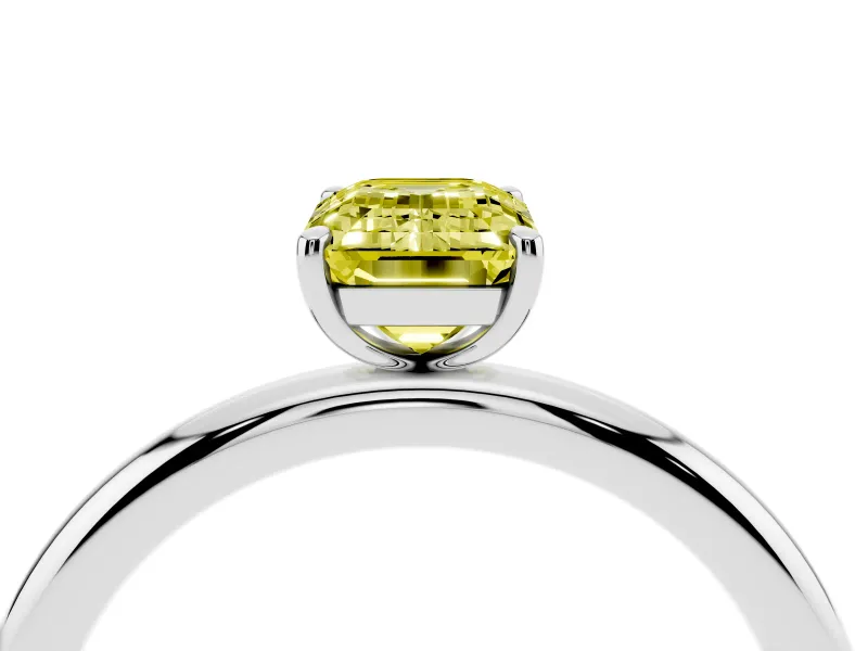 Fancy Yellow Emerald Cut Diamond Solitaire Ring Set in Platinum with Prong Setting on a Polished Plain Band