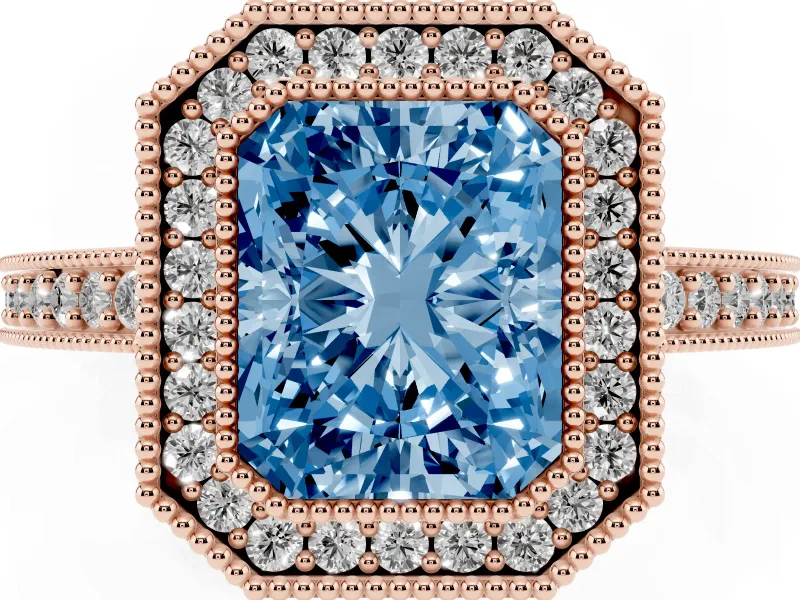 Fancy Blue Radiant Cut Diamond Halo Engagement Ring Set in Rose gold with Pavé Band and Round Halo Stones