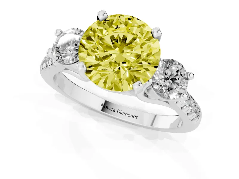Fancy Yellow Three-Stone Round Cut Diamond Pavé Band Ring Set in Platinum with Prong-Set Trio