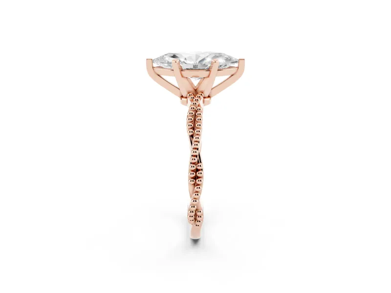 Marquise Cut Diamond Solitaire Ring Set in Rose gold with Twisted Band and Bead Prong Setting
