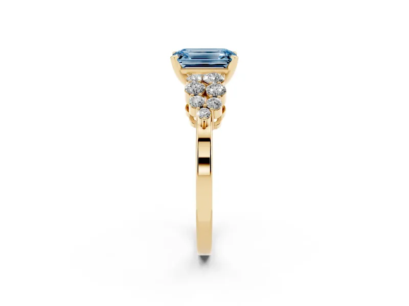 Fancy Blue Emerald Cut Diamond Cluster Engagement Ring Set in Yellow gold with Pavé Band and Prong Setting
