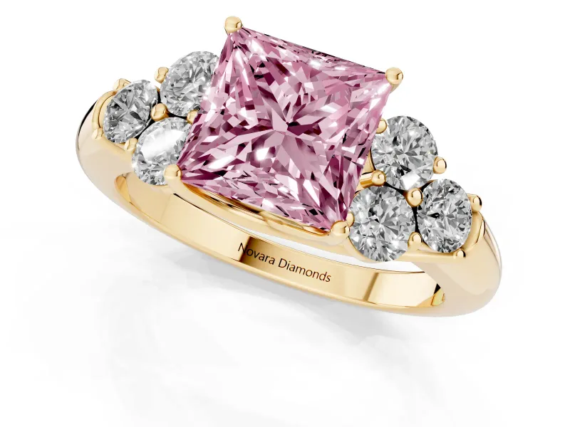 Fancy Pink Princess Cut Diamond Cluster Ring Set in Yellow gold with Round Accent Stones and Prong Setting on a Plain Band