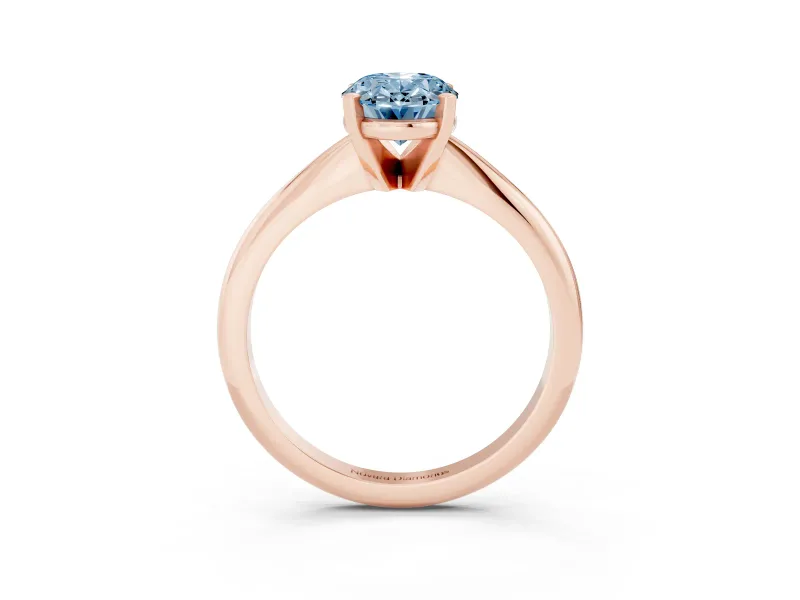 Fancy Blue Oval Cut Diamond Solitaire Ring Set in Rose gold with Prong Setting on a Plain Round Band