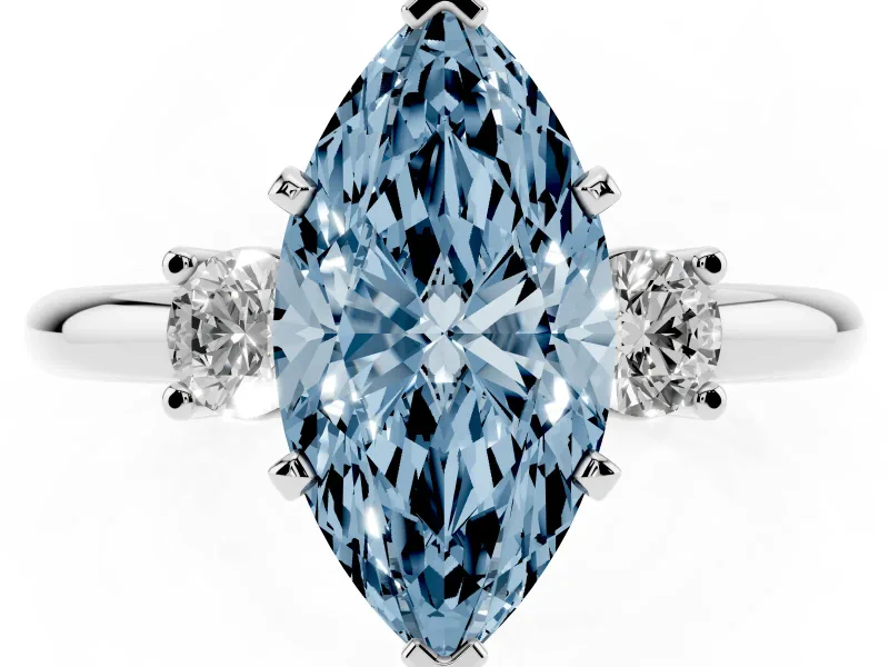 Fancy Blue Three-Stone Marquise Cut Diamond Ring Set in White gold with Prong Setting and Plain Band