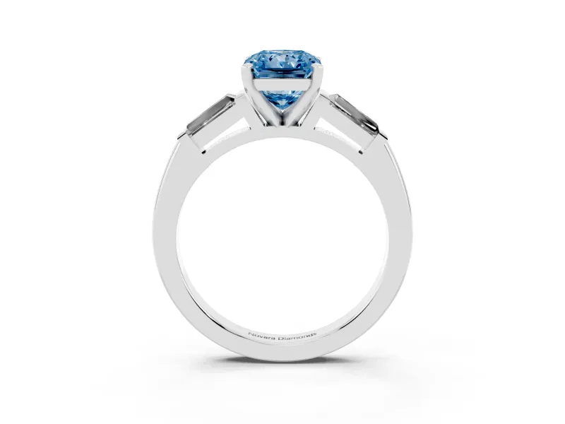 Fancy Blue Radiant Cut Diamond Solitaire Ring Set in White gold with Tapered Baguette Side Stones and Prong Setting