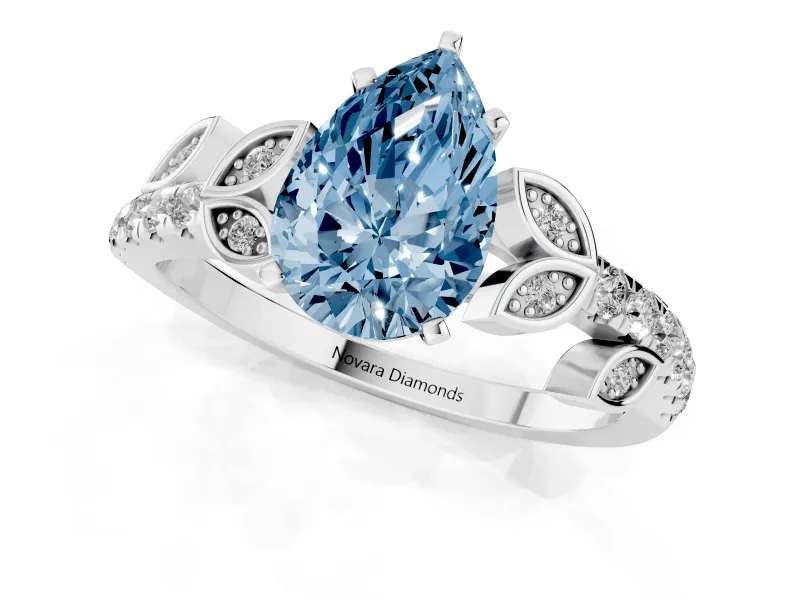 Fancy Blue Pear Cut Diamond Solitaire Leaf-Inspired Ring Set in Platinum with Pavé Band and Prong Setting
