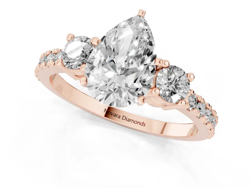 Pear-Shaped Three Stone Pavé Engagement Ring Setting | Round Side Stones | Rose Gold