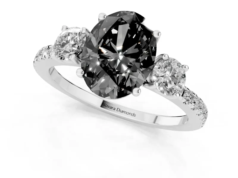 Fancy Black Oval Cut Diamond Three-Stone Ring Set in Platinum with Pavé Band and Graduated Sides