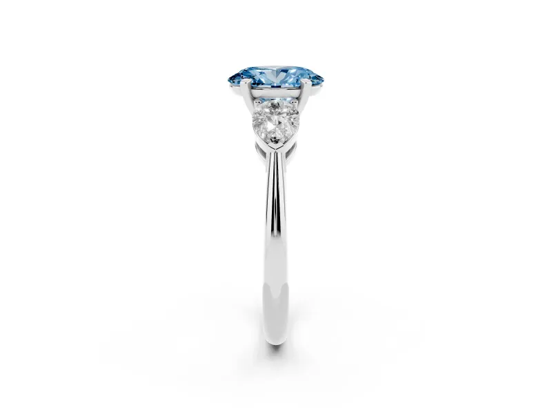 Fancy Blue Three-Stone Oval Cut Diamond Ring Set in Silver with Pear Side Stones and Prong Setting