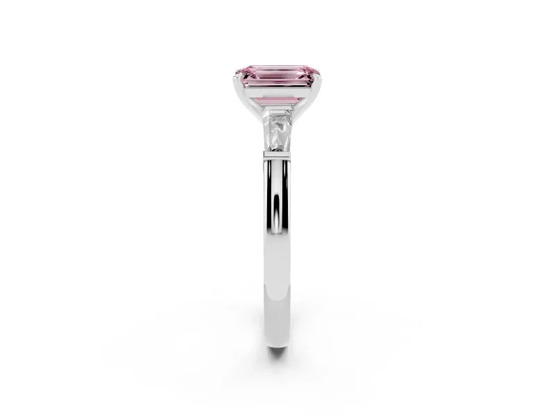Fancy Pink Emerald Cut Diamond Solitaire Ring Set in Silver with Tapered Baguette Side Stones and Prong Setting