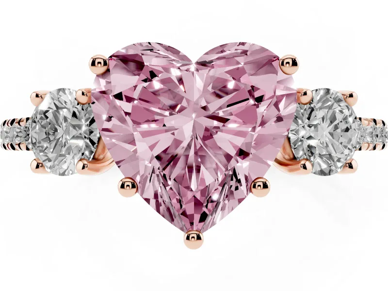 Fancy Pink Heart Cut Diamond Three-Stone Ring Set in Rose gold with Pavé Band and Graduated Sides