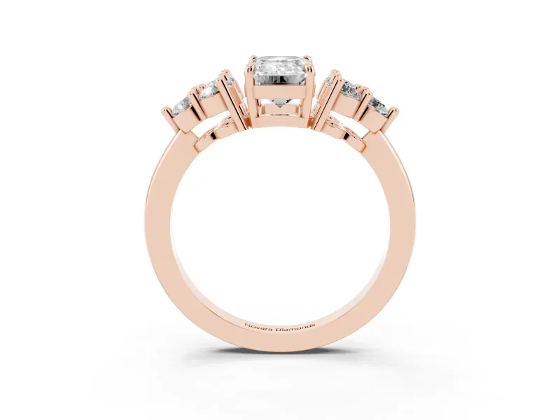 Emerald Cut Diamond Solitaire Ring Set in Rose gold with Cluster Accents on Each Side