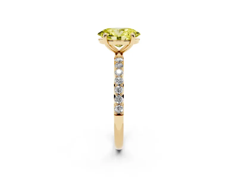 Fancy Yellow Oval Cut Diamond Solitaire Ring Set in Yellow gold with Round Pavé Band and Prong Setting