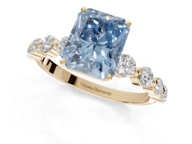 Radiant Cut Graduated Side Stone Engagement Ring Setting for a Fancy Blue Lab-Grown Diamond | Yellow Gold