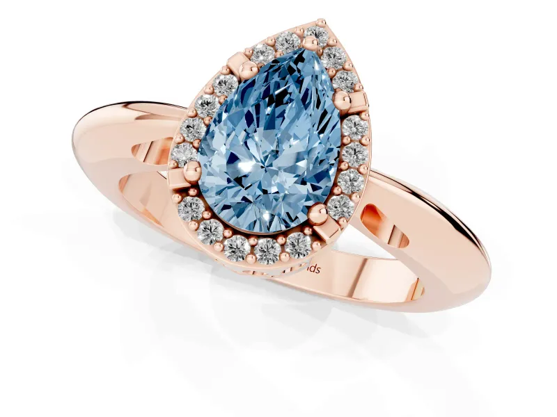 Fancy Blue Pear Cut Diamond Halo Engagement Ring Set in Rose gold with Plain Split Shank and Prong Setting