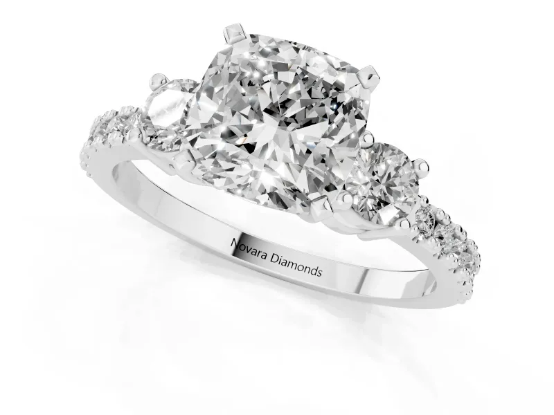 Three-Stone Cushion Cut Diamond Pavé Band Ring Set in White gold with Prong Setting