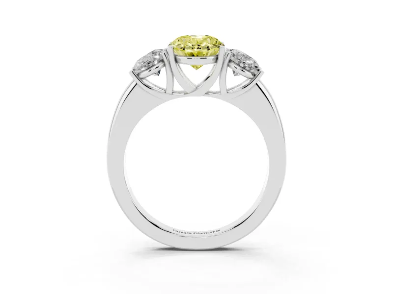 Fancy Yellow Oval Cut Diamond Three-Stone Ring Set in Platinum with Bold Center and Classic Band