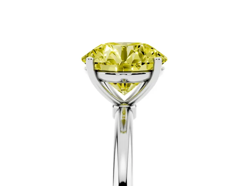 Fancy Yellow Round Cut Diamond Solitaire Engagement Ring Set in Silver with Thin Band and Prong Setting