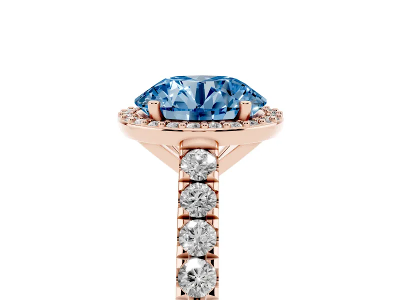 Fancy Blue Round Cut Diamond Halo Engagement Ring Set in Rose gold with Pavé Band and Prong Setting