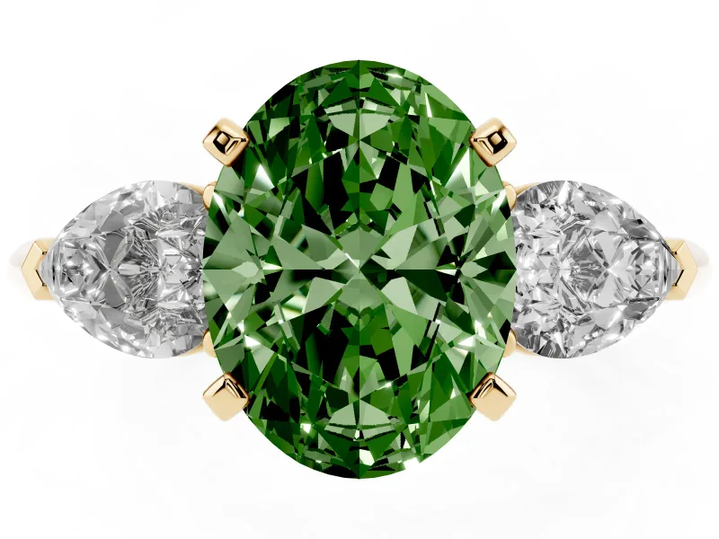 Fancy Green Three-Stone Oval Cut Diamond Ring Set in Yellow gold with Pear Side Stones and Prong Setting