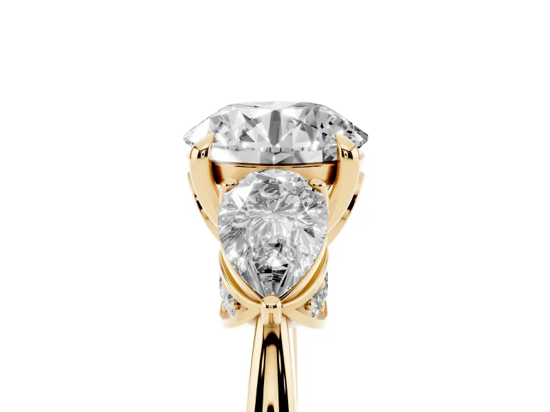 Round Cut Diamond Three-Stone Ring Set in Yellow gold with Pear Side Stones