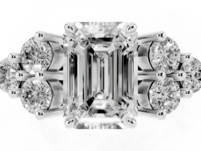 Emerald Cut Diamond Solitaire Ring Set in Platinum with Cluster Accents on Each Side