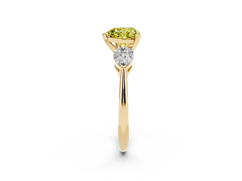 Fancy Yellow Three-Stone Heart Cut Diamond Ring Set in Yellow gold with Pear Side Stones and Prong Setting