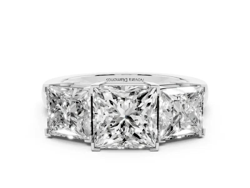 Princess Cut Diamond Three-Stone Ring Set in Platinum with Channel-Set Band and Prong Settings