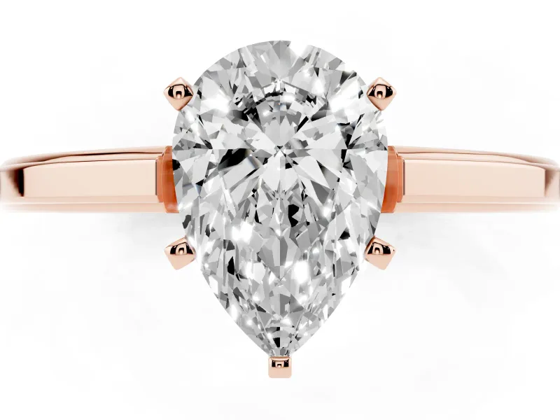 Pear Cut Diamond Solitaire Ring Set in Rose gold with Prong Setting and Classic Band