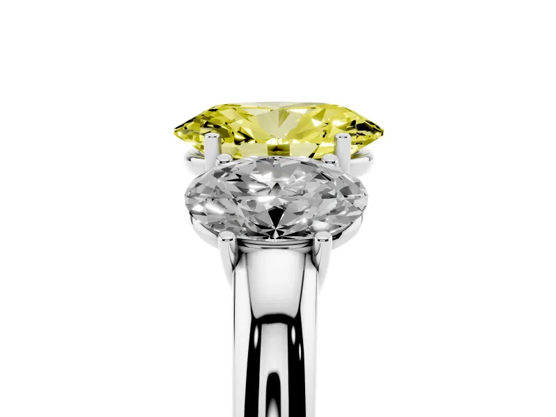 Fancy Yellow Oval Cut Diamond Three-Stone Ring Set in Platinum with Bold Center and Classic Band