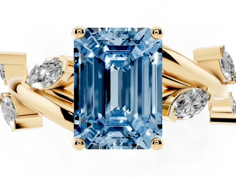 Fancy Blue Emerald Cut Diamond Solitaire Ring Set in Yellow gold with Twisted Marquise Accent Band