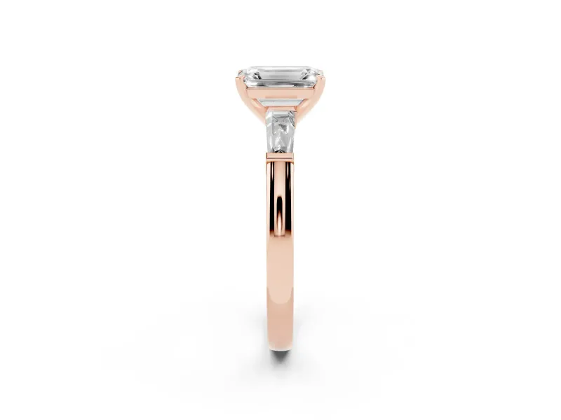 Emerald Cut Diamond Solitaire Ring Set in Rose gold with Tapered Baguette Side Stones and Prong Setting