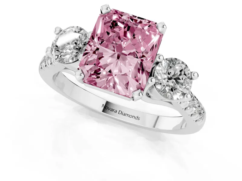 Fancy Pink Three-Stone Radiant Cut Diamond Pavé Band Ring Set in White gold with Prong-Set Trio