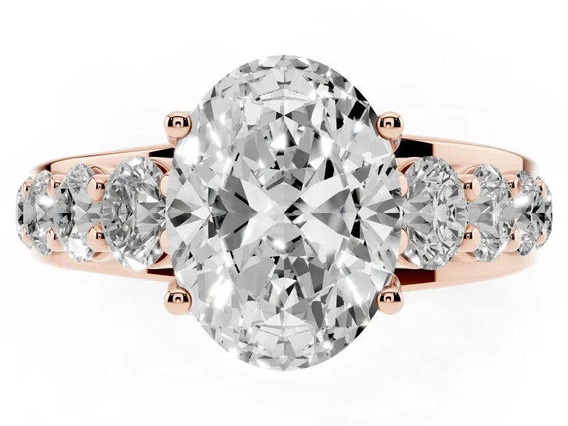 Oval Graduated Side Stone Engagement Ring Setting | Shared Prong Rails | Rose Gold