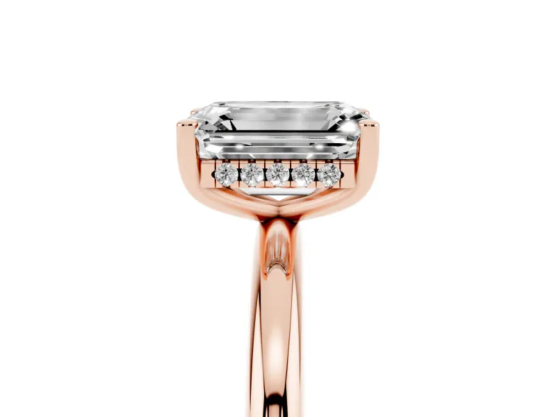 Emerald Cut Diamond Solitaire Engagement Ring Set in Rose gold with Prong Setting and Polished Band