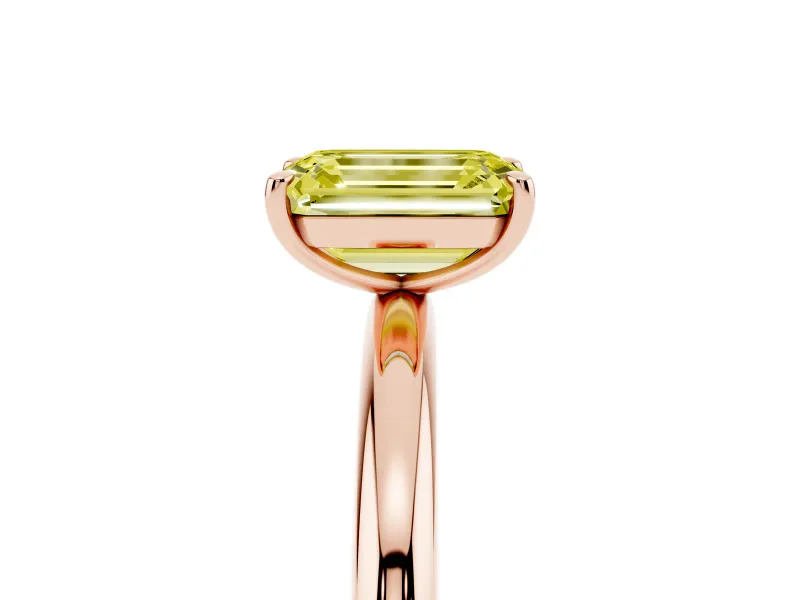 Fancy Yellow Emerald Cut Diamond Solitaire Ring Set in Rose gold with Prong Setting on a Polished Plain Band