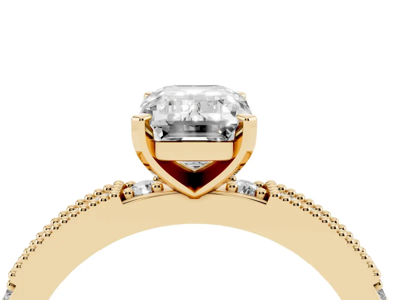 Emerald Cut Diamond Solitaire Ring Set in Yellow gold with Slim Pavé Band and Prong Setting