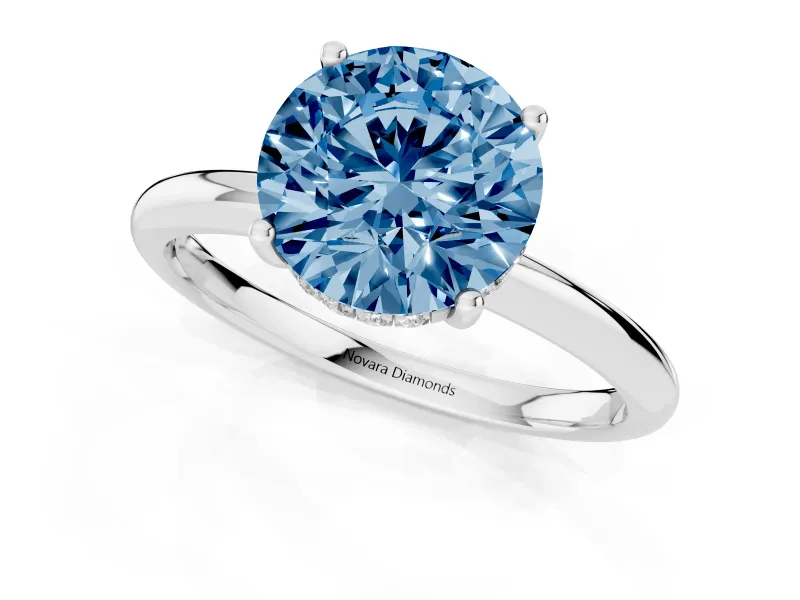 Fancy Blue Round Cut Diamond Solitaire Engagement Ring Set in Platinum with Prong Setting and Polished Band