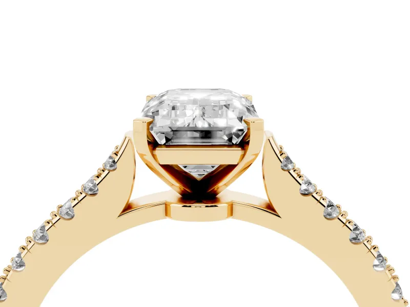 Emerald Cut Diamond Solitaire Engagement Ring Set in Yellow gold with Delicate Pavé Band and Prong Setting