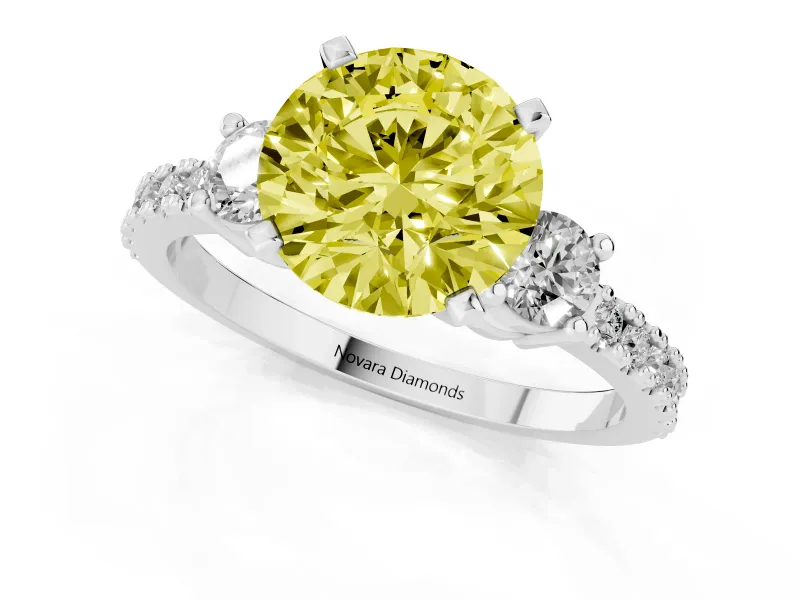 Fancy Yellow Three-Stone Round Cut Diamond Pavé Band Ring Set in White gold with Prong Setting