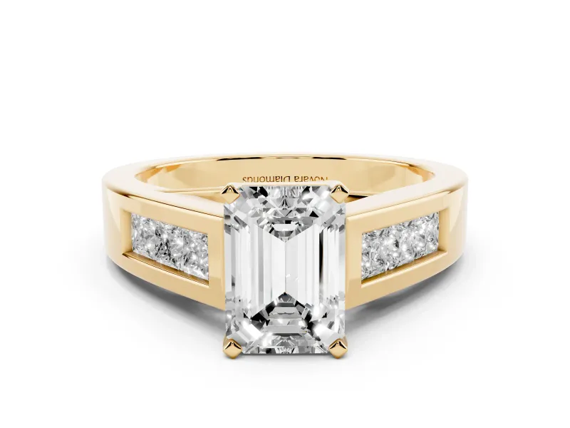 Emerald Cut Diamond Solitaire Ring Set in Yellow gold with Channel-Set Accent Stones and Prong Setting