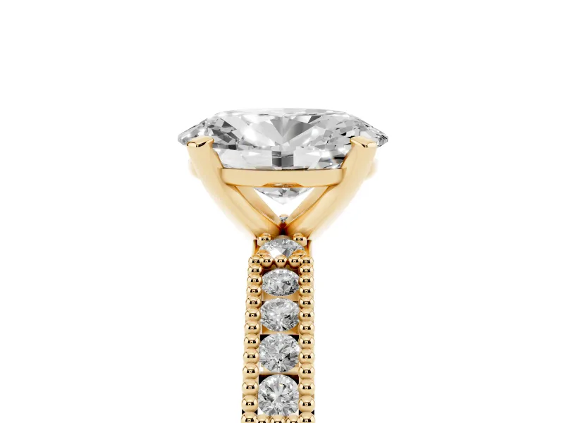 Oval Cut Diamond Solitaire Ring Set in Yellow gold with Slim Pavé Band and Prong Setting