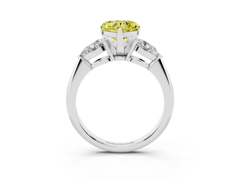 Fancy Yellow Three-Stone Heart Cut Diamond Ring Set in White gold with Pear Side Stones and Prong Setting