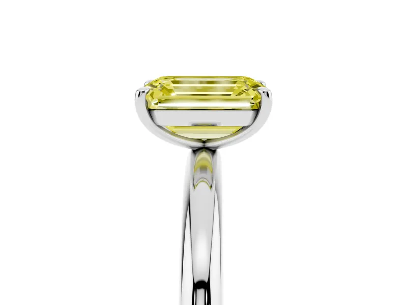 Fancy Yellow Emerald Cut Diamond Solitaire Ring Set in White gold with Prong Setting on a Polished Plain Band