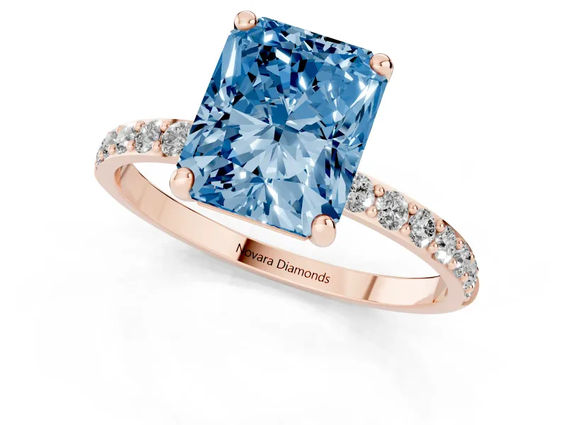 Fancy Blue Radiant Cut Diamond Solitaire Ring Set in Rose gold with Round Pavé Band and Prong Setting