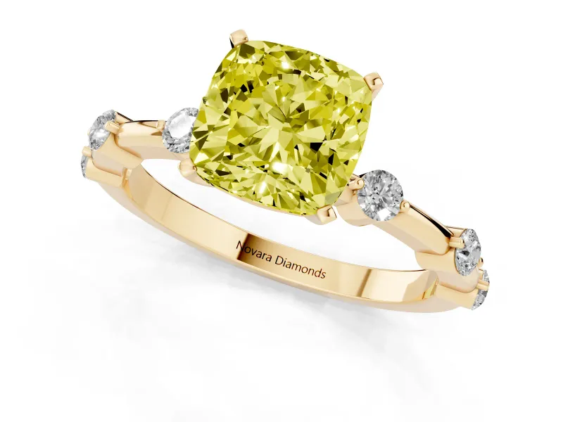 Fancy Yellow Cushion Cut Diamond Solitaire Ring Set in Yellow gold with Bezel Set Side Stones and Prong Setting