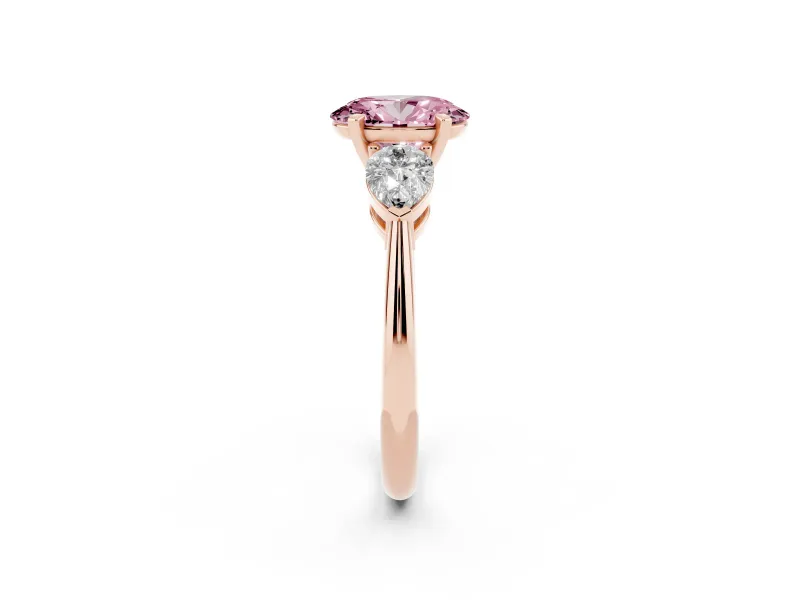 Fancy Pink Three-Stone Oval Cut Diamond Ring Set in Rose gold with Pear Side Stones and Prong Setting