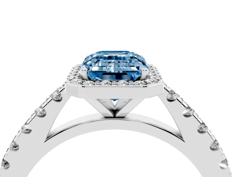 Fancy Blue Emerald Cut Diamond Halo Engagement Ring Set in Silver with Pavé Band and Prong Setting