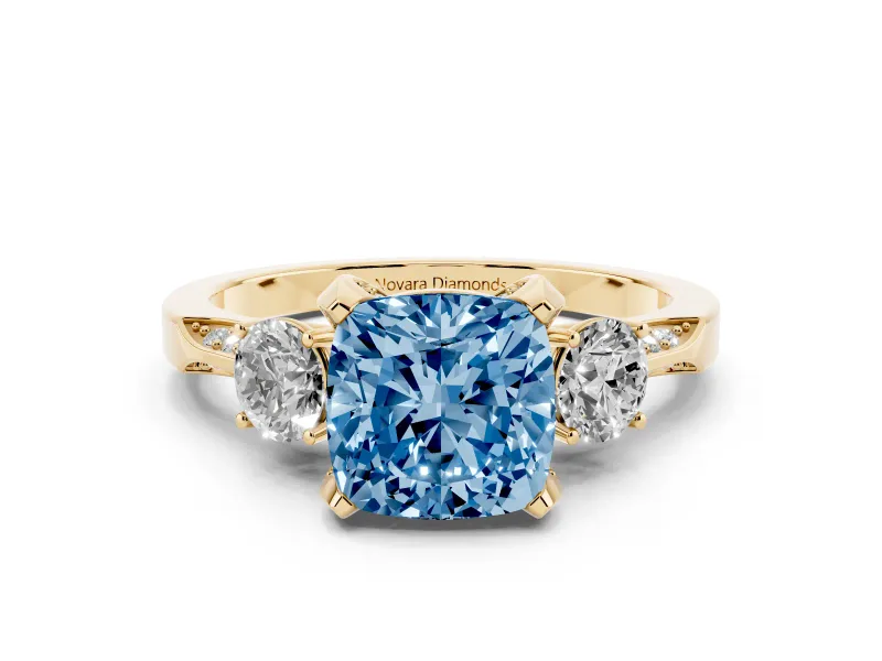 Fancy Blue Cushion Cut Diamond Three-Stone Ring Set in Yellow gold with Pavé Band and Smaller Side Stones